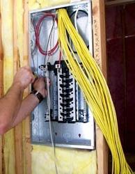 A person working on an electric box.