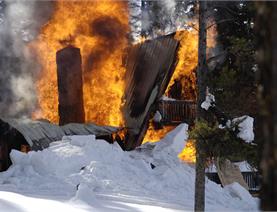 A house that is on fire.